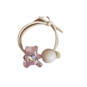 Rosa Bär Haargummi mit Herzkristall, beigem Gummiband und goldenem Metallanhänger