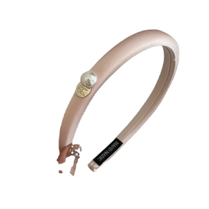 Pink satin padded headband with pearl detail and handmade label for women hair styling