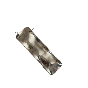 Minimalist silver wave metal hair clip with hammered texture and liquid metal finish