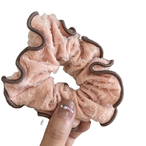 Pink mesh scrunchie with coffee brown trim and pleated layers for women's hair styling