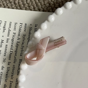 Pink ribbon bow hair clip made of acetate with France Handmade gold text on white plate