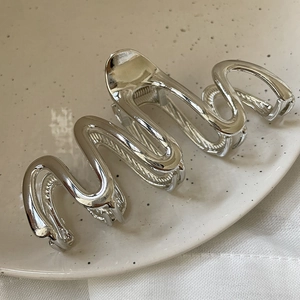Silver metallic large shark clip with wavy design for elegant women's hairstyles