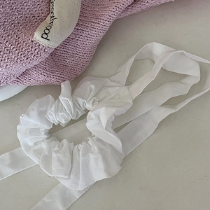 Elegant white ribbon scrunchie with long streamers and pleated fabric in balletcore style