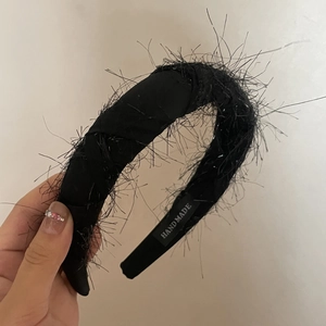 Handmade black feather headband for women with stylish fringe hair accessory design