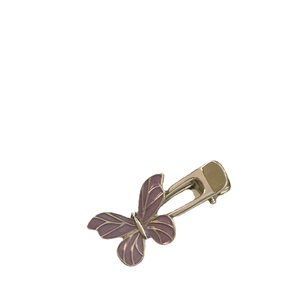 Purple butterfly hair clip with silver metal duckbill clamp on a white background