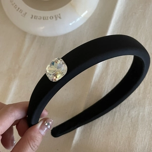 Elegant black padded sponge headband featuring a large sparkling square rhinestone crystal