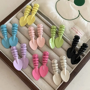 Colorful candy-colored spoon shaped hair clips set in diverse bright glossy shades