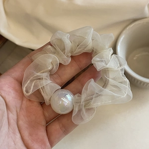 Elegant beige organza hair scrunchie with large iridescent pearl charm detail