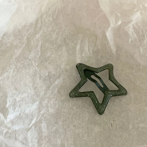 Y2K style dark green star hair clip with silver glitter finish and metal BB clip