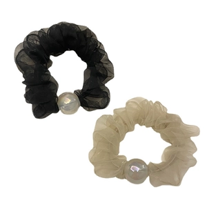 Black and beige chiffon organza hair scrunchies with iridescent pearls on white background