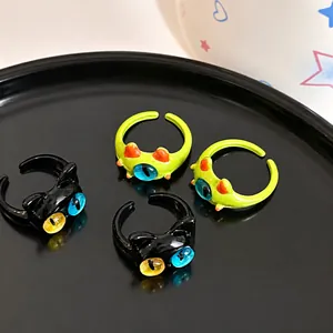 Quirky cat and frog monster ring set with colorful eyes in vibrant Y2K style