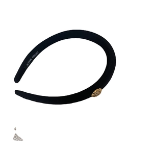 Classic black fabric headband with golden camellia flower and handmade detail