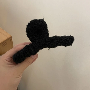 Large black plush claw clip made of warm faux fur fabric for women winter hair styling