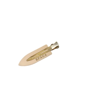 Beige resin duckbill hair clip with golden metal base and RPAGA letter design