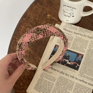 Detail of pink and brown plaid tweed headband with non-slip beige velvet lining