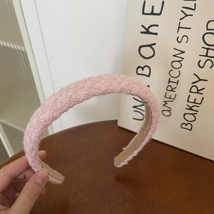 Detail of pink tweed headband with thick sponge padding and non-slip velvet lining texture