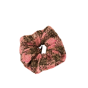 Pink and black plaid fabric scrunchie with soft vintage texture for autumn hair styling