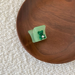 Elegant green acetate hair claw clip featuring a cute 3D bear with pearl accent