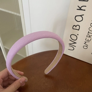 Detailed view of lavender tweed headband showing textured knit fabric and suede lining