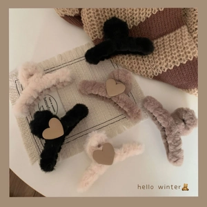 Detail of plush heart claw clips in milk tea colors with warm winter aesthetic