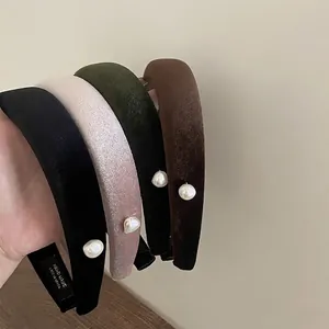 Handmade velvet headbands with baroque pearl accents in black, green, pink, and brown