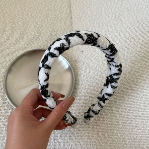 Detail showing high-texture black and white woven pattern on high-top headband