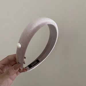 Pink velvet headband with a pearl accent, handmade with non-slip lining and Korea label