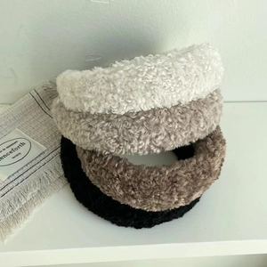 Chic plush lamb wool headbands in four neutral colors with thick fuzzy texture