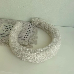 Plush cream white sherpa headband with thick padded design for autumn and winter head styling
