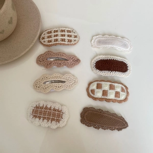 Set of 8 handmade knitted bow hair clips for girls in warm beige and brown tones