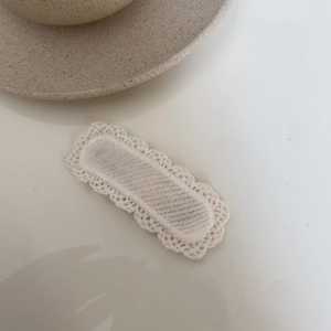 Lace-covered cream fabric BB hair clip for girls with Korean style embroidery on white background