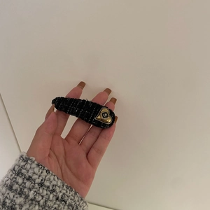 Classic black and white tweed hair clip with gold heart charm and number five detail