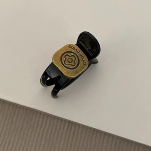 Retro black resin hair claw clip with vintage gold clover engraved metal plate