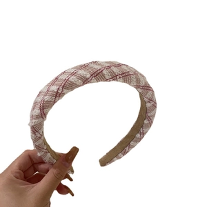 Pink and white tweed wide headband featuring French style woven texture on white background