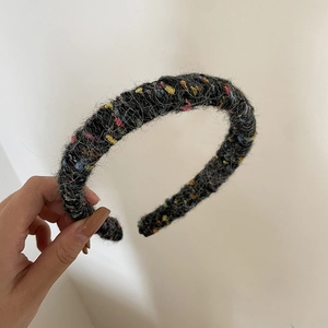 Thick colorful knit headband made of black wool blend fabric for winter fashion style