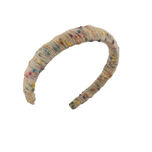 Winter chunky knit headband with colorful confetti yarn texture on white background