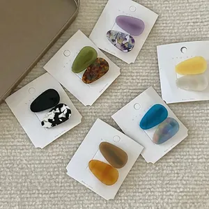Set of minimalist acetate teardrop hair clips in various colors and marble patterns