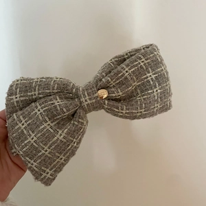 French style grey tweed bow hair clip with gold glitter wire and engraved metal button