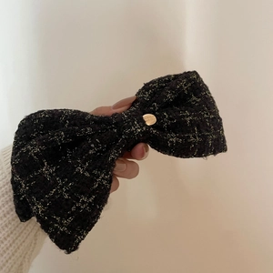 French tweed bow hair clip with gold metal badge and Believe In Yourself text