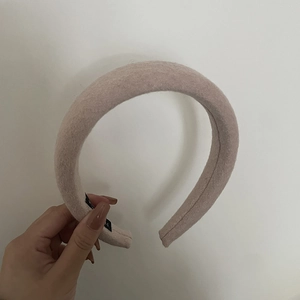 Plush pink wool-like headband with padded sponge design for an elegant voluminous look