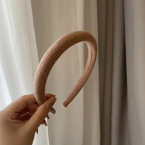 Close-up of the thick camel wool fabric texture and soft padding on this elegant headband