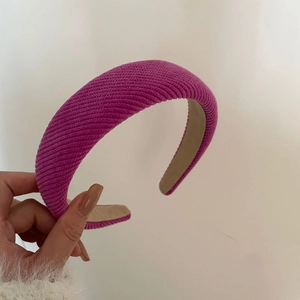 Chic fuchsia tweed padded headband with thick ribbed texture for high-volume hair styling