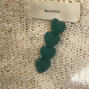 Cute dark green plush heart hair clip for women with soft fabric texture in Korean style