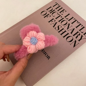 Pink plush flower claw clip hair accessory with crochet floral detail for women