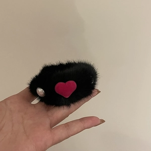 Furry black scrunchie with pink heart and silver bead detail for elegant hair styling