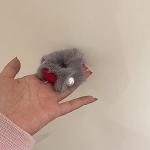 Gray faux fur heart hair tie with red heart tag and white pearl accent for winter styles