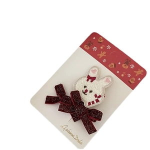 Fermaglio natalizio con coniglietto di peluche bianco e fiocco di paillettes rosse