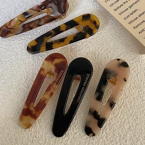 Five-piece acetate duckbill hair clip set with tortoiseshell and marble patterns