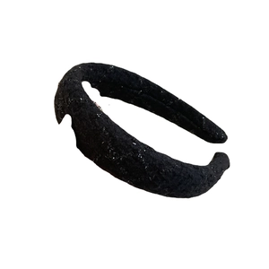 Sparkly black padded headband with French chic glitter fabric on a clean white background