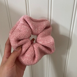 Pink and white tweed scrunchie for women made of textured fabric with a stylish fluffy design